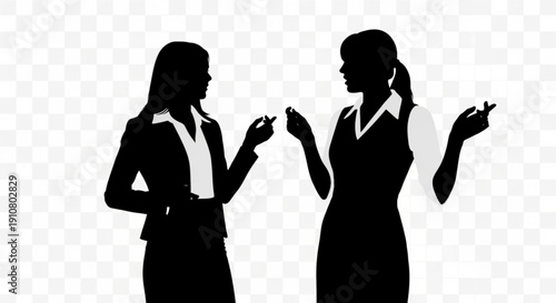 Two business women in silhouette discussing something in a professional setting