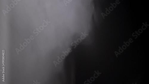White smoke billows and swirls dynamically against a solid black backdrop. The soft, ethereal movement creates a mysterious and atmospheric texture perfect for overlays and special effects.