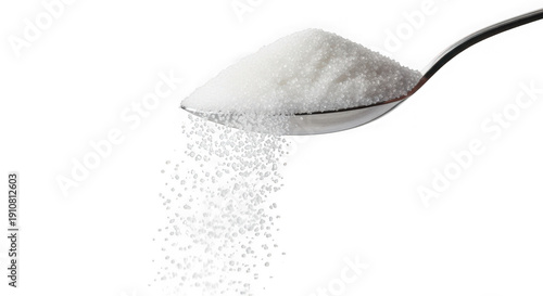 White sugar pouring from metal spoon on white background transparent background