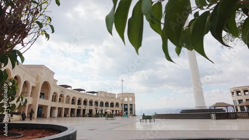 Aqaba, Jordan - 10th december, 2025: time lapse view Arab Revolt Plaza Aqaba Jordan city square with monumental flagpole historic landmark Red Sea coastal tourism destination modern architecture