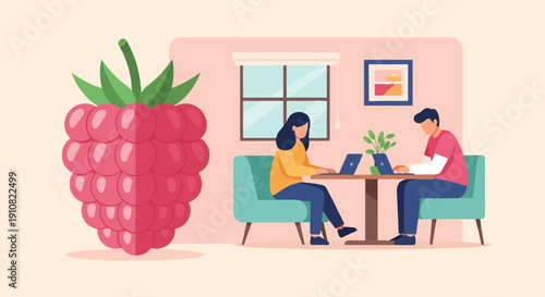 Large raspberry next to two people working on laptops at a table