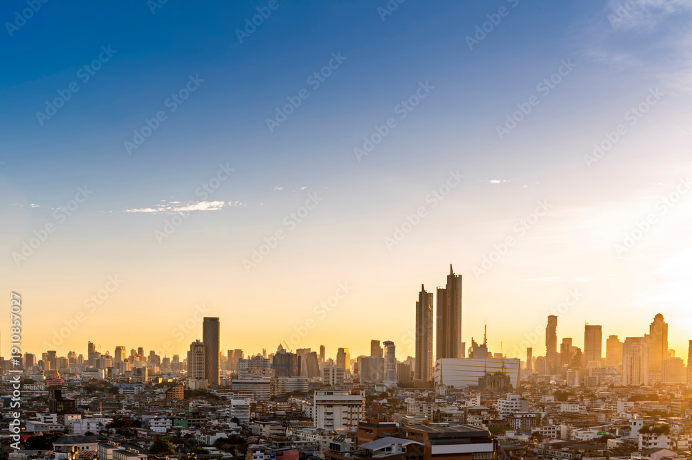 Fototapeta premium Cityscape of Bangkok city skyline with sunset sky background, Bangkok city is modern metropolis of Thailand and favorite of tourists