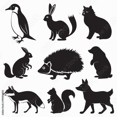 A collection of black vector silhouettes featuring a set of wild and domestic animals including a dog, cat, horse, deer, and kangaroo for nature design illustrations