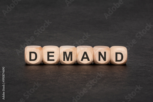 DEMAND word on wooden cubes, economic and business market concept. Conceptual pair with supply in portfolio.