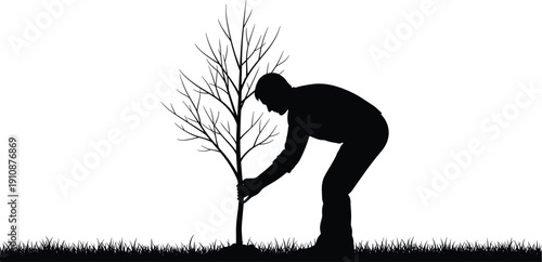 Black silhouette of a man planting a young sapling tree in the ground on a grassy field isolated on white background for environmental concepts
