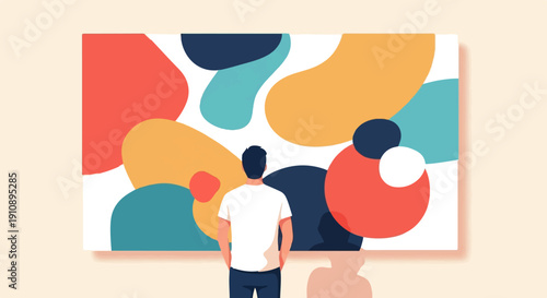 Person observing abstract art on a wall
