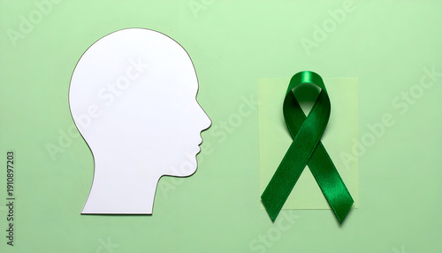 Wallpaper Mural Mental health awareness concept with white human head silhouette and green ribbon on a pastel green background. Generative AI. Torontodigital.ca