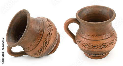 Vintage Pottery Jugs with Geometric Etchings and Decorative Dishes in Studio Shot