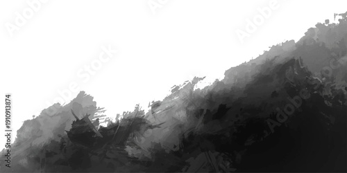 A scenic alpine panorama of a snow-covered mountain peak rising through cold winter fog and clouds above a rocky glacier valley