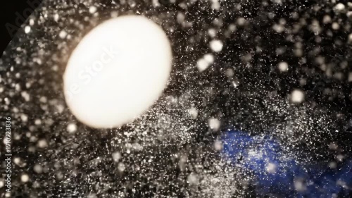 Transparent sphere containing sparkling cosmic dust on dark background