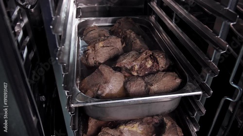 Roasted Meat In The Oven Tray Cooking, Juicy Beef Pieces