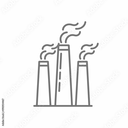 Industrial chimneys releasing vapor or smoke into the sky above a factory complex