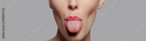Φωτογραφία Woman Sticking Out Tongue With Red Lipstick Closeup