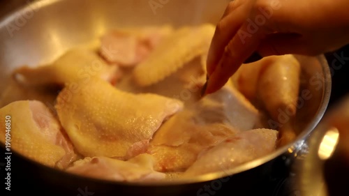 Chicken Pieces Sizzling In Hot Frying Pan. Cooking Poultry 