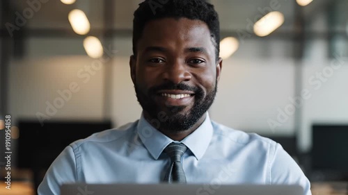 Radiant Confidence: A portrait of a professional man exuding confidence as he looks straight into the camera, illuminating a sense of assurance and competence.