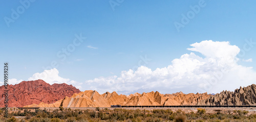 Canvas Print The train passes through the colorful stone mountains