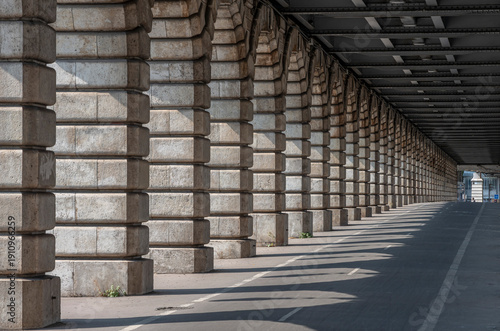 Paris, France - 08 15 2025: Graphical detail view of the arches of the Bercy Bridge