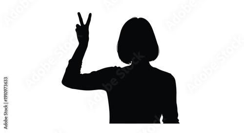 Silhouette of a person making a peace sign with their hand raised