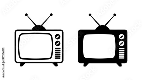 Two old television sets with antennas side by side on white