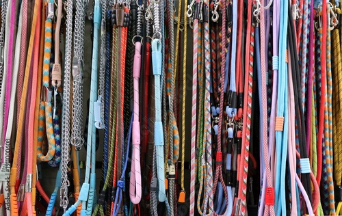 Foto Colorful dog leashes in the pet store. Background and texture.