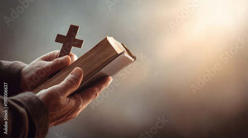 Hands Holding Holy Bible with Wooden Cross Spiritual Concept