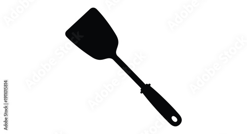 A stark silhouette of a black spatula against a clean white background showcasing kitchen utensil simplicity high quality