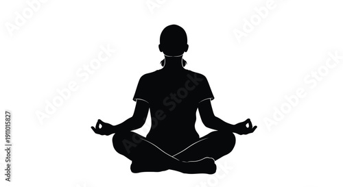 Silhouette of a person meditating in a lotus position