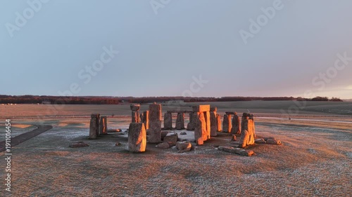 A drone view of snow-covered Stonehenge and the Wiltshire countryside in England, UK. The stone circle dates back to 3000 BC and is one of the most famous ancient wonders of the world and a UNESCO