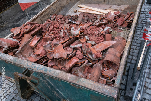 broken roof tiles in construction waste, roof renovation