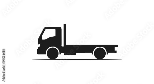 A simple black silhouette depicts a flatbed truck viewed from its side showcasing basic vehicle form high quality