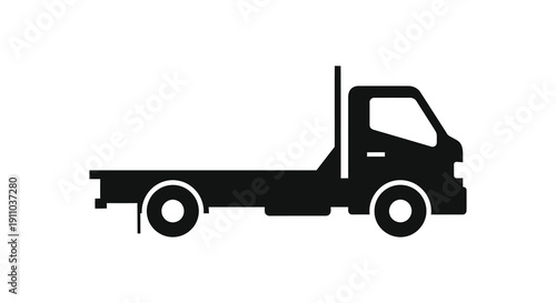 A stark black silhouette depicts a simplified flatbed truck showcasing its basic form and functionality high quality professional