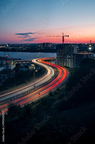 Night traffic in the city, lines from car headlights at sunset in Nizhny Novgorod