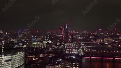 Wallpaper Mural Establishing an aerial view of London, the city skyline, Shard and Tower Bridge in foreground, Canary Wharf in the background, and the United Kingdom evening dusk night  Torontodigital.ca