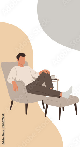 Modern Man Relaxing Comfortably Seated In Stylish Armchair At Home
