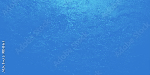 A clear turquoise pool surface creates an abstract summer background featuring transparent blue ripples and liquid light reflections on the clean wet water texture