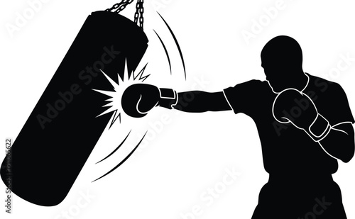 Black and white silhouette of a strong male boxer hitting a heavy punching bag during a gym workout session