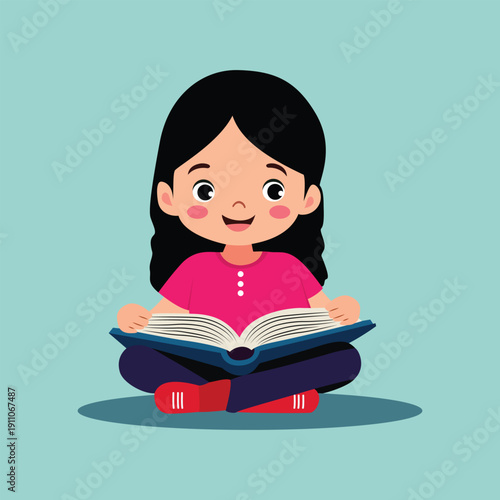 A young girl sitting cross legged reading a book with a smile