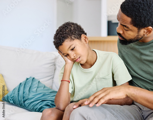 Canvas Print Portrait of a teenage boy son talking to his father at home