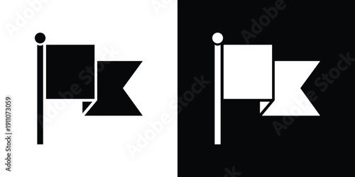 Black and white flag with geometric shapes on a pole