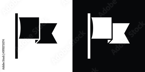 Black and white flag with triangular shapes on a pole