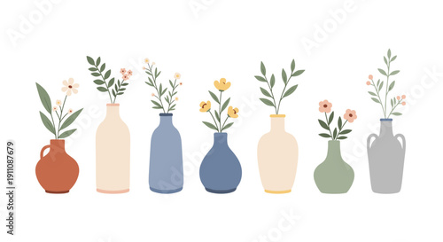 A row of diverse minimalist vases in muted colors holds simple branches with delicate flowers and green leaves.