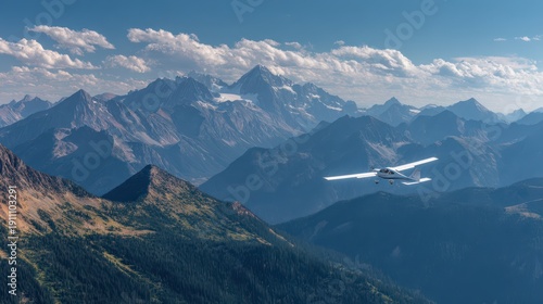 Wallpaper Mural Small propeller plane towing a blank banner over an alpine mountain range at midday Torontodigital.ca