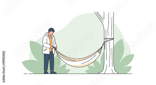 Man Setting Up A Hammock Between Two Trees For Relaxation