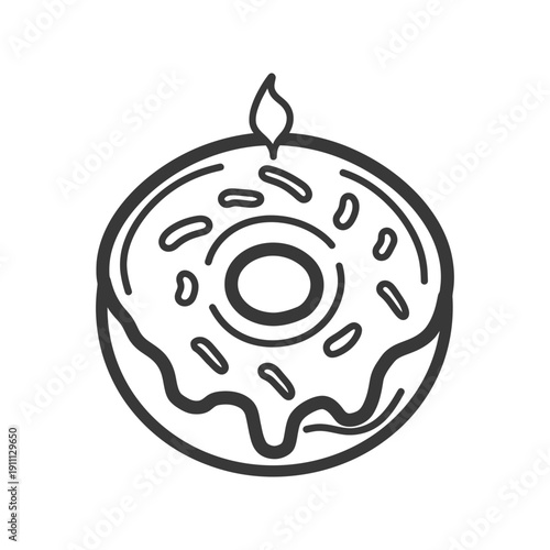 A decorative frosted donut cake with single lit candle on top