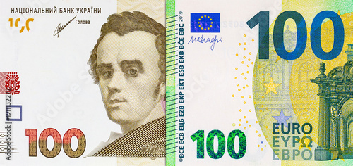 100 Euro of the European Union and 100 Ukrainian hryvnia. Money of Europe. Money of Ukraine.