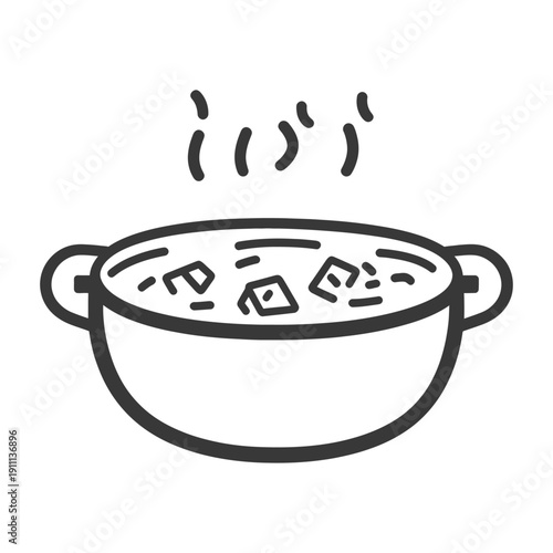 A steaming bowl of cooked food with visible ingredients inside
