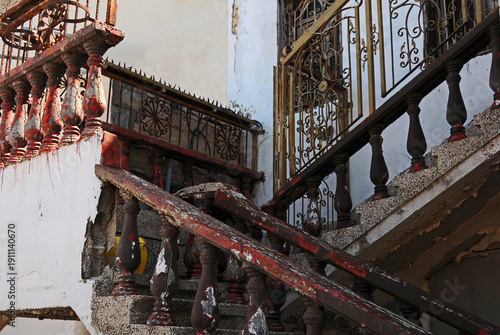 Dilapidated staircase and balcony