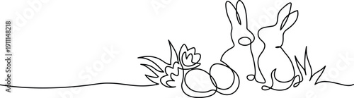 A black and white drawing of two rabbits sitting next to eggs