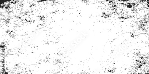 Abstract grunge wall background featuring a rough concrete texture with vintage paper patterns and dirty paint effects on a gray surface