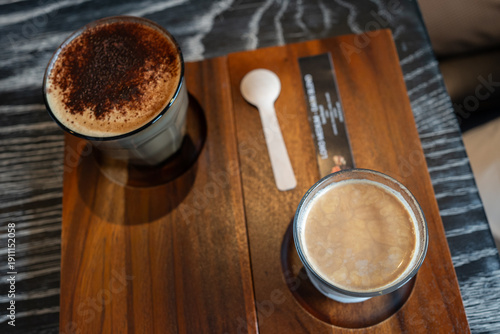 Top of cold dairy coffee drink with milk, whipped cream. Foamy frappe, latte, cappuccino.Summer cold coffee cocktail